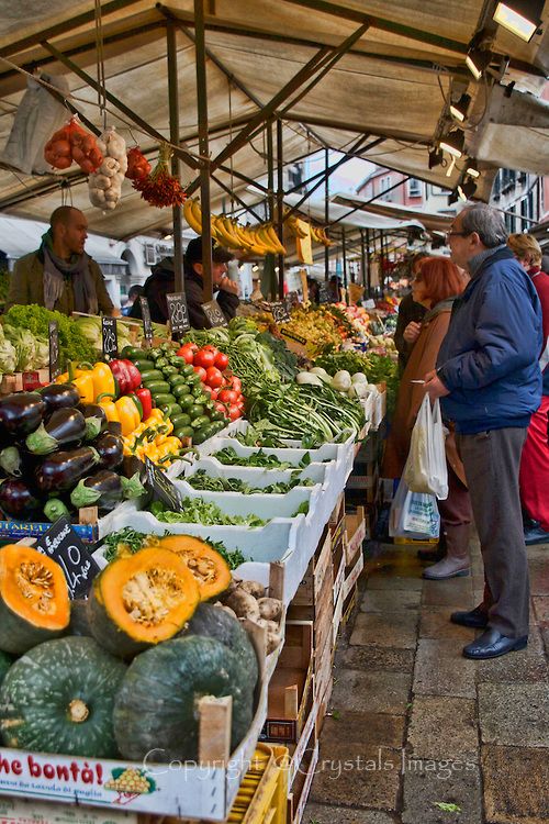 Customer shopping for produce in a market aisle